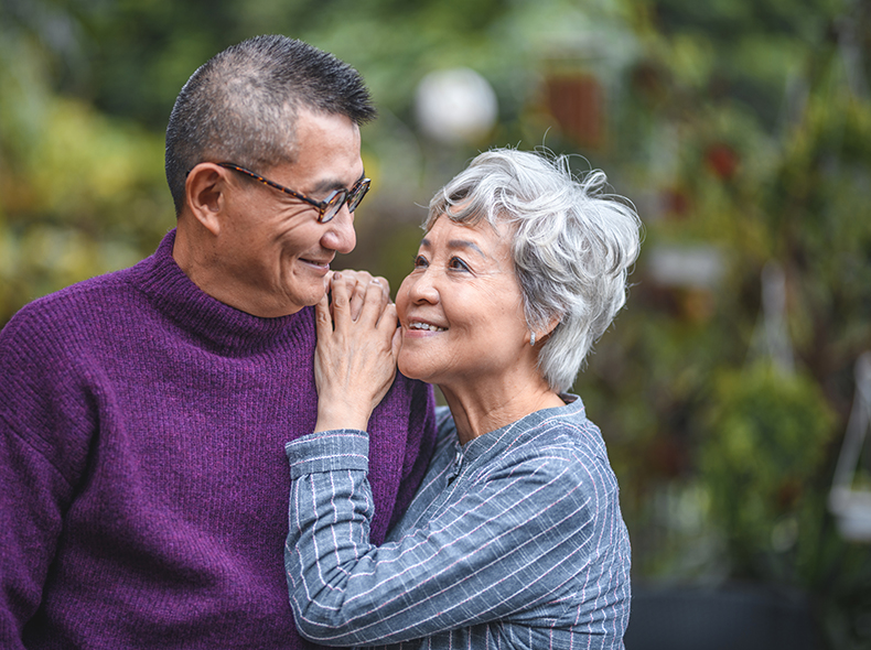 A smiling retired couple outdoors