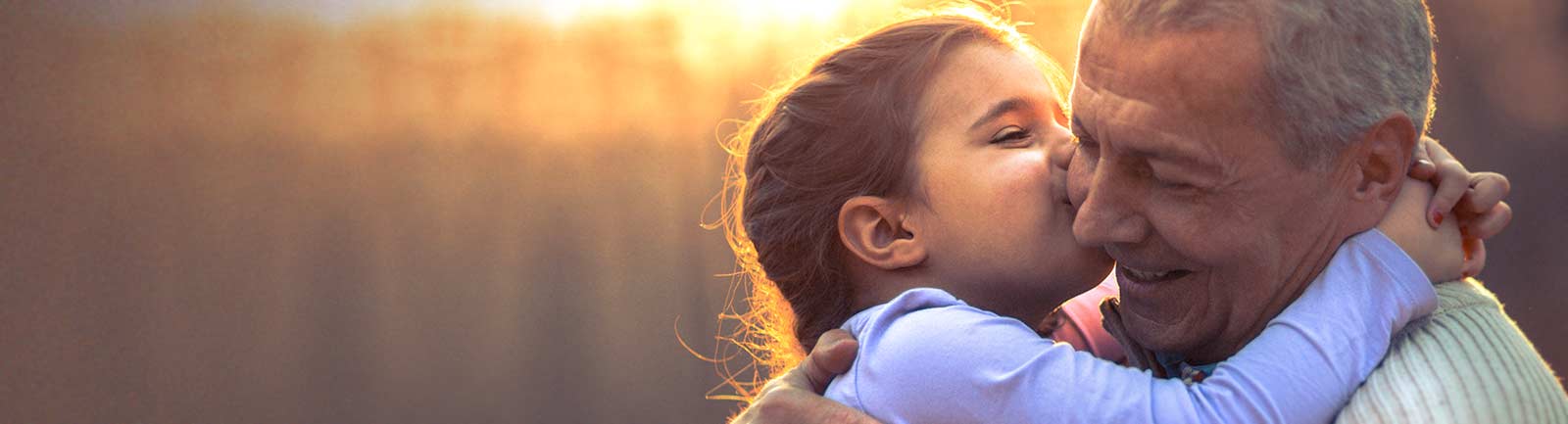 Grandaughter kissing her grandfather