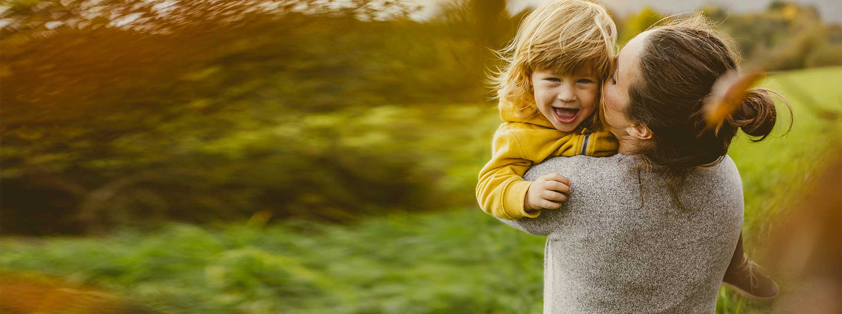 Mother and child enjoy breathing easily outdoors after seeing an ENT doctor.
