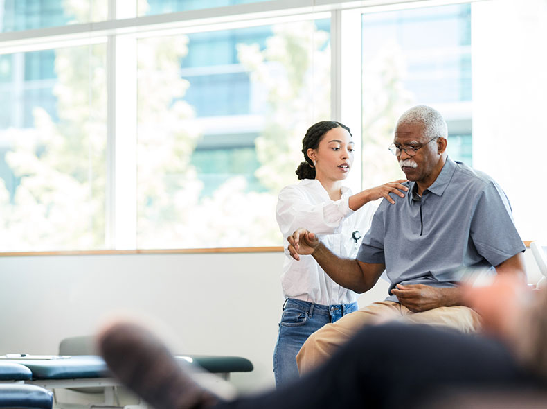an occupational therapist helping an older patient