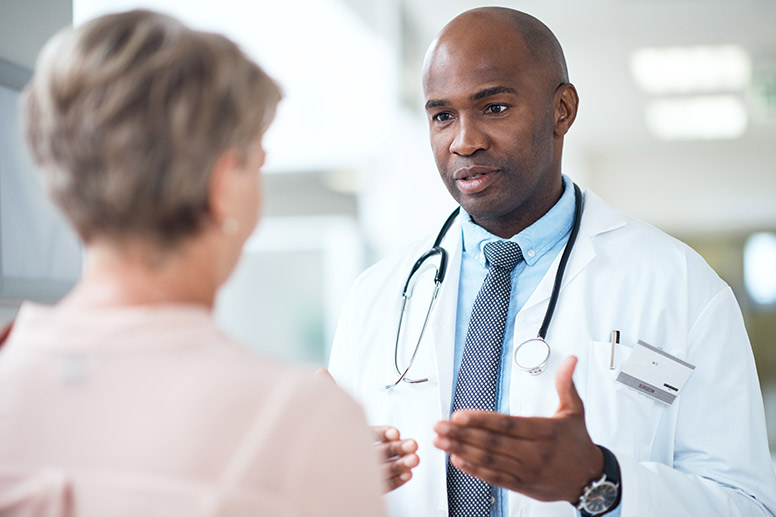 Doctor with patient talking