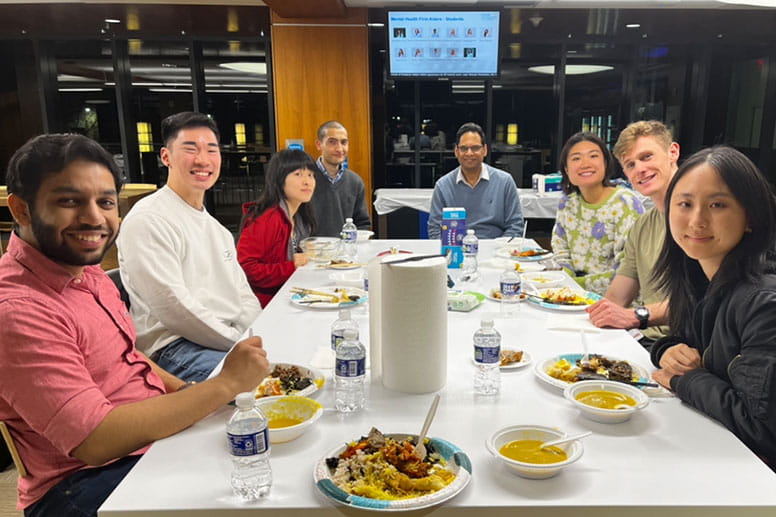 a group of students having dinner