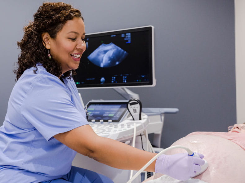 A medical professional giving an ultrasound