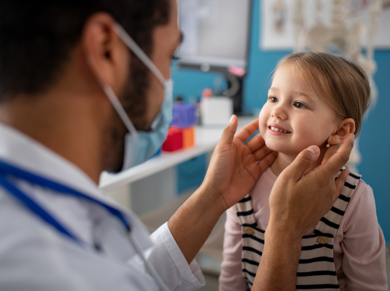 A child receiving an otolaryngology check-up