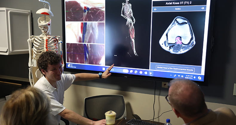 a student looking at a computer