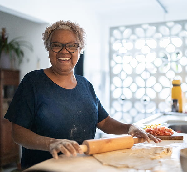 A Medicare Advantage member rolling out dough