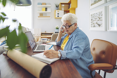 Senior woman on computer at home
