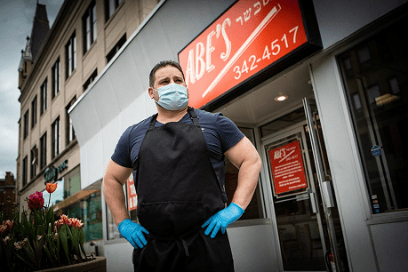 Store owner wearing mask