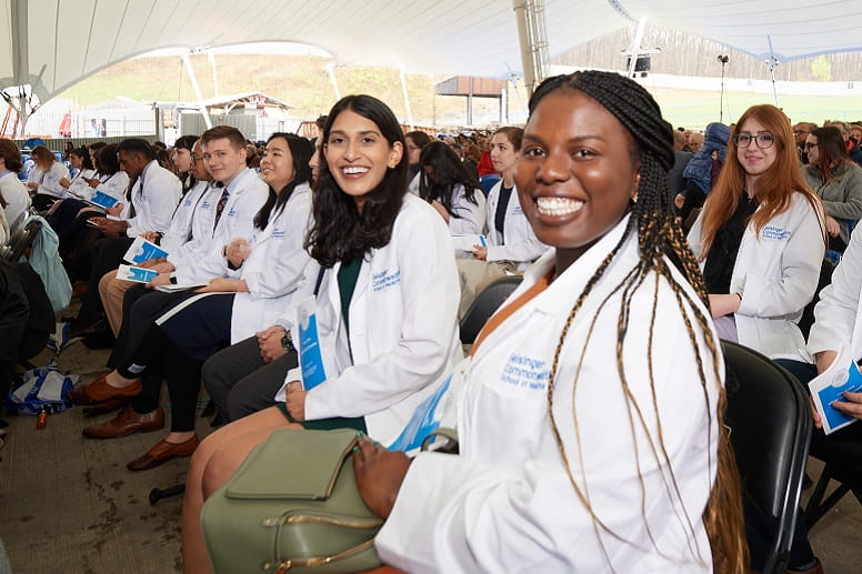 Young woman using a machine to conduct a medical test in a laboratory