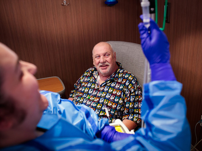 Man getting injection from nurse.
