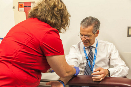 Dr. David Feinberg gets his blood drawn.