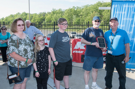 The Walsh family receives a plaque.