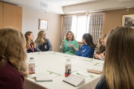 High school students at Geisinger's AIM HI event listen to a presentation.