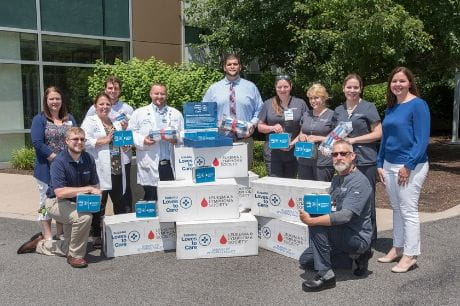 Members of Geisinger Wyoming Valley Medical Center prepare to deliver blankets from Subaru and the Leukemia and Lymphoma Society 