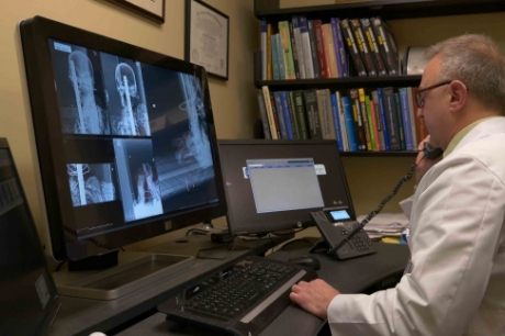 Dr. Sauerwine reviews images of the mummy.