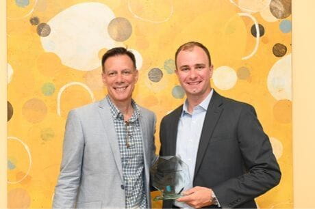 Jason Gibson receives award.