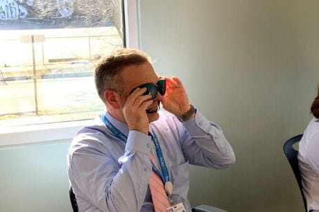 Doctor participates in sight services training.