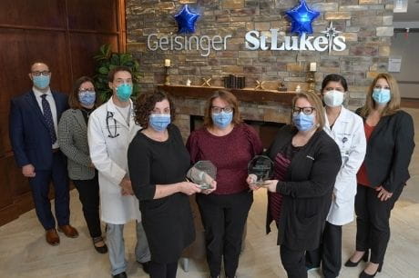 Leadership at Geisinger St. Luke's Hospital holding the Press Ganey Award