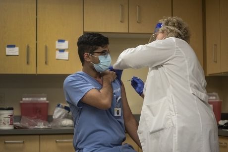 Resident physician Muhammad Sabih Saleem receives the second dose of the COVID vaccine.