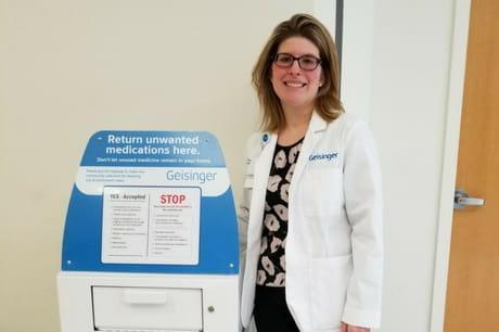 Jenny Plummer with medication disposal box