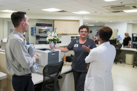 Staff speak inside the GSWB emergency department waiting room.