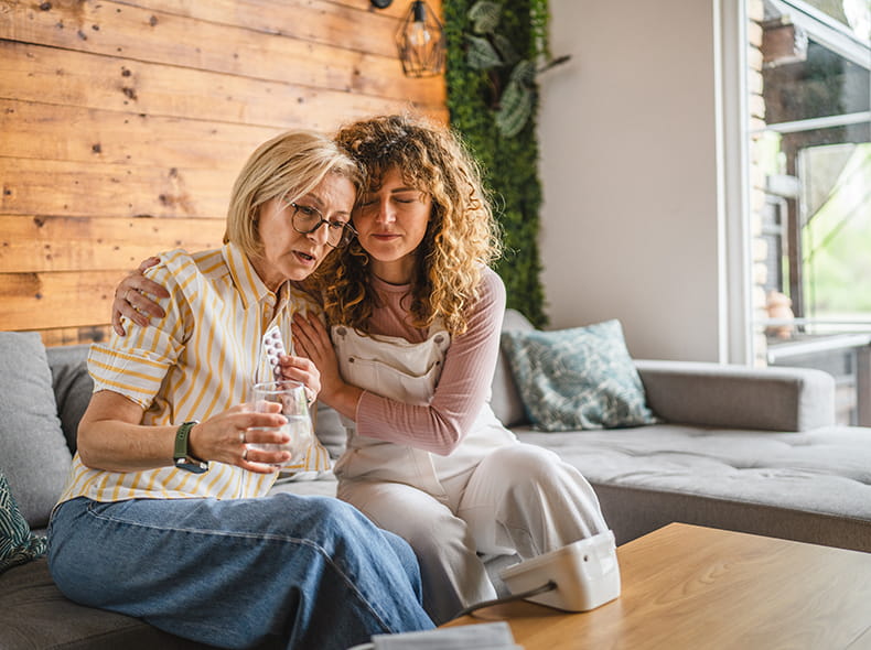 Daughter taking care of sick mother