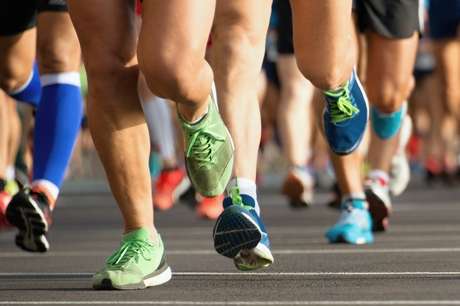 Runners feet on the pavement.