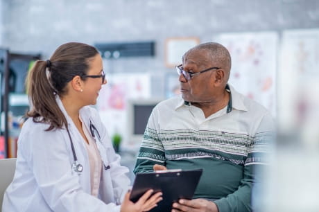 Man sitting with his doctor