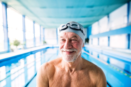 Older man swimming.