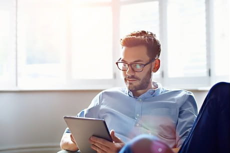 Man reading health information regarding Coronavirus