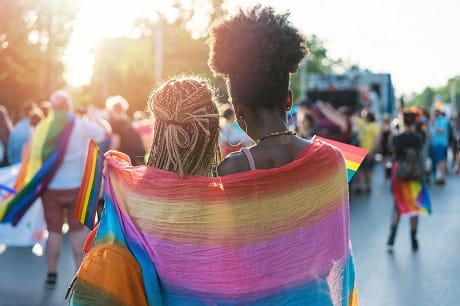 Two people watching a parade