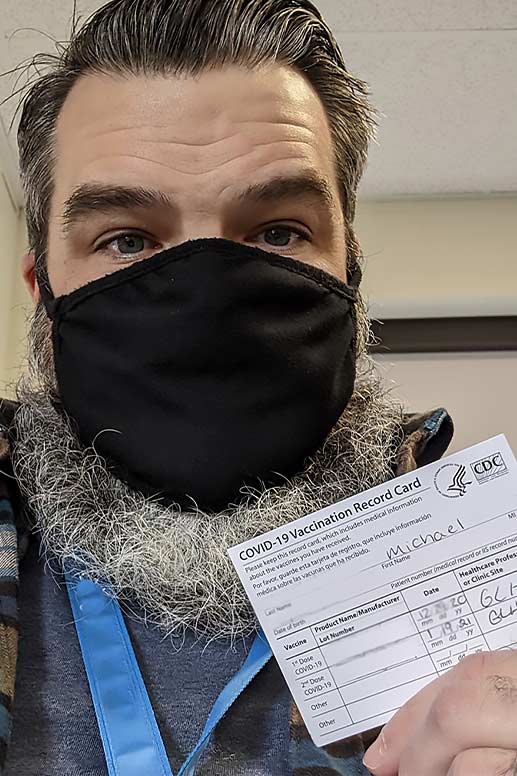 Mike receives his first COVID vaccination shot.