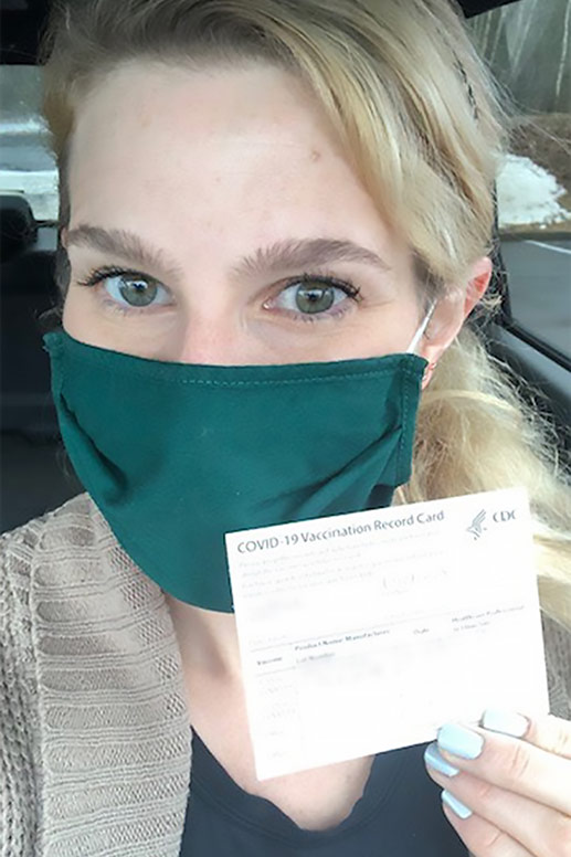 Rachael receives her first COVID vaccination shot.