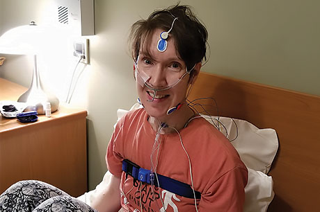 Female patient connected to leads prepares for a night in the Geisinger sleep lab.