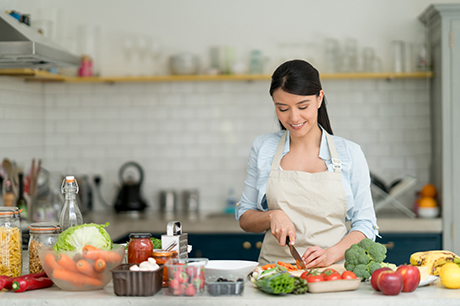 Woman chopping veggies