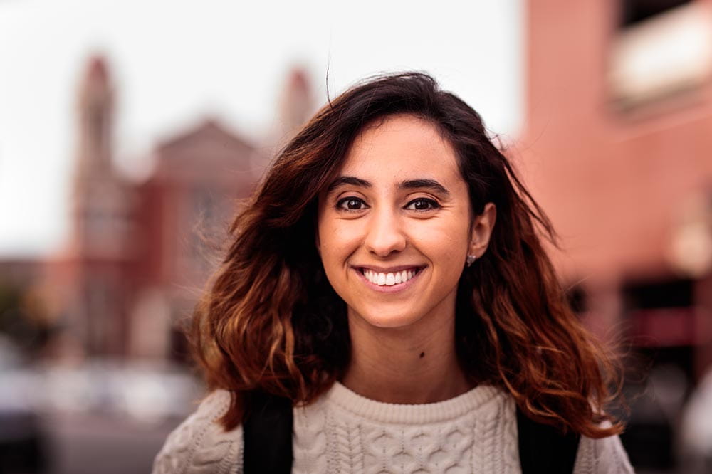 A woman smiling