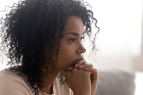 A woman with a stressful look