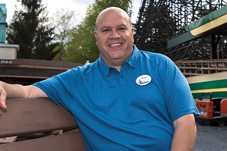 Brian Knoebel sits on a park bench in his family-owned amusement park in Elysburg, PA.