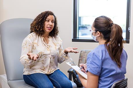 A woman talking to her doctor