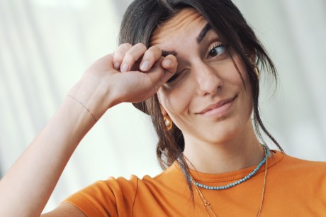 woman suffering from eye twitching