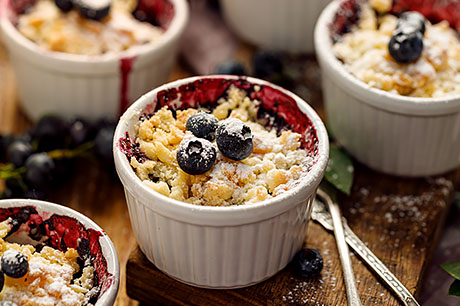 A prepared serving of blueberry crisp.