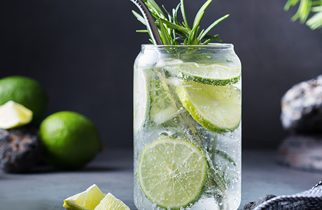 Glass of sparking water with lime. 