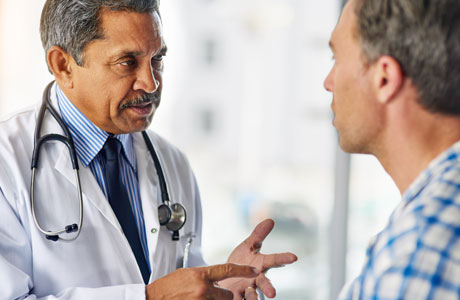 Doctor consulting a man patient. 