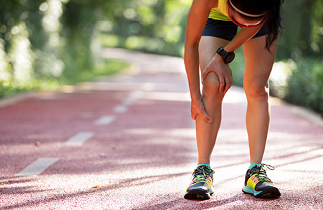 A women holding her leg