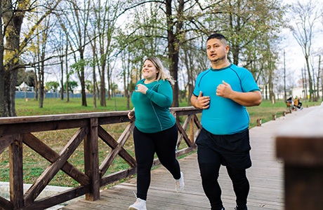 Couple training and running outdoors.