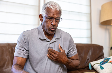 A man experiencing chest pain