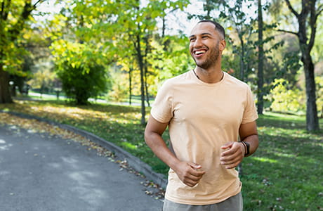 Stress relief. Man jogging in a park.  