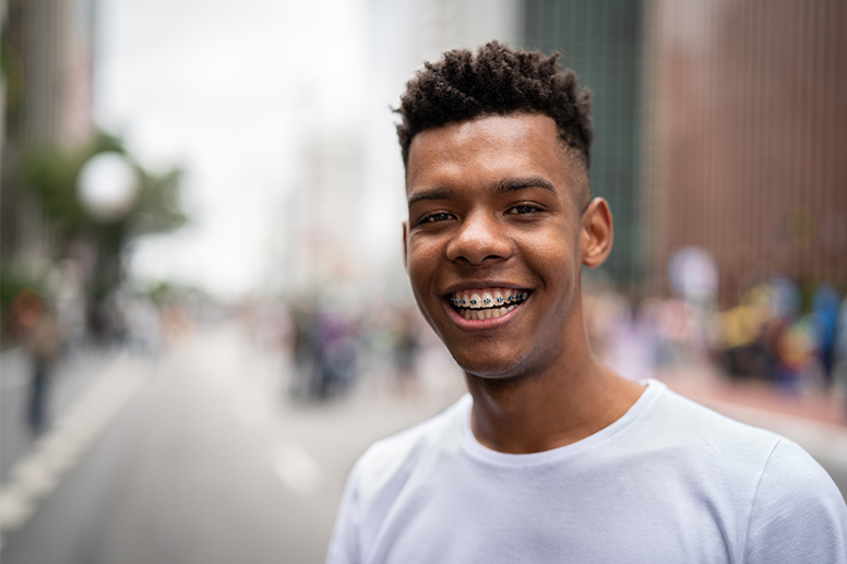 young boy smiling with braces 