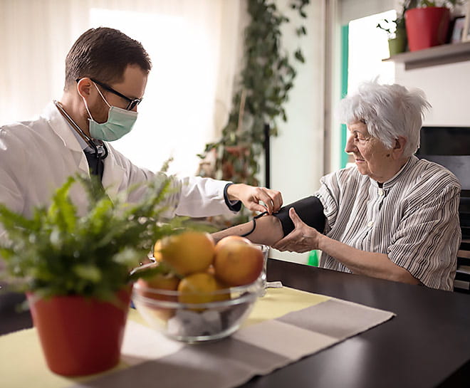 An elderly patient receives home health care.