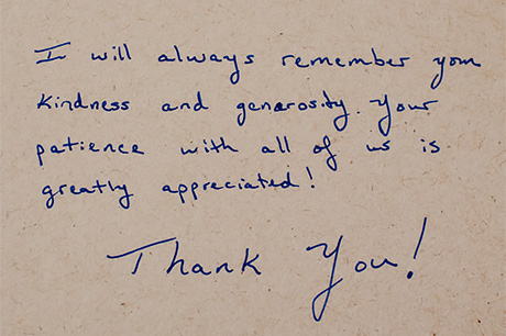 Handwritten thank-you note for participation in medical education on a beige background.